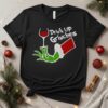Grinch hand drink up Grinches Merry Christmas 2025_T-Shirt